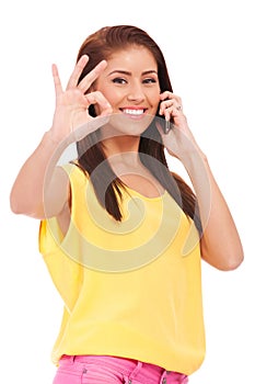 Casual woman with phone and ok gesture