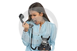 Casual woman screaming at someone over the phone