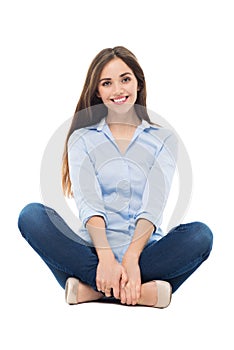 Casual woman sitting over white background