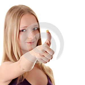 Casual woman smiling with her thumbs up