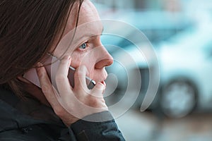 Casual woman using mobile phone for communication outdoors