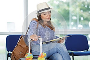 casual woman using waiting to board plane