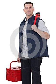 Casual worker carrying wrench