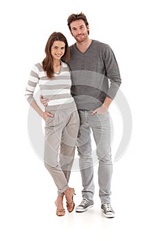 Casual young couple embracing smiling photo