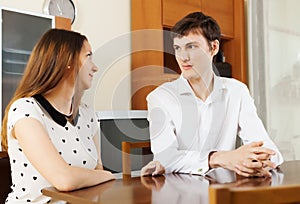 Casual young couple having serious talking