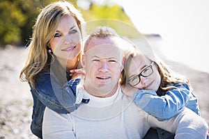 Casual young family on the beach