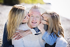 Casual young family on the beach