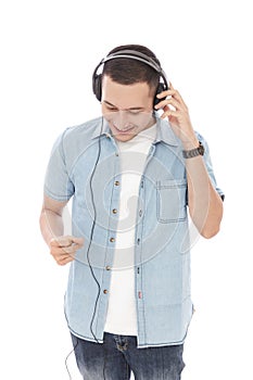 Casual young man enjoy music wearing headphones