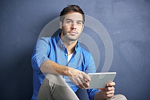 Casual young man with pc tablet