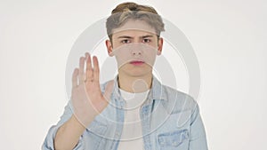 Young Man Showing Stop Sign on White Background