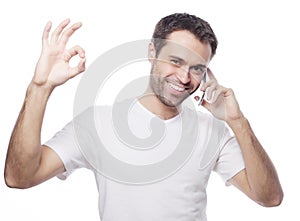casual young man showing thumbs up sign