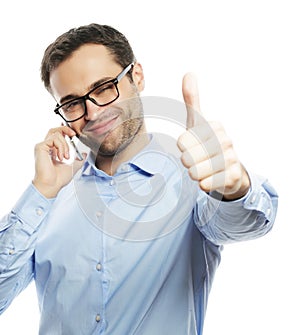 casual young man showing thumbs up sign