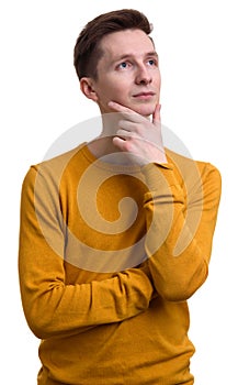 Casual young man thinking and looking up