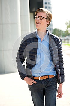 Casual young man walking outdoors