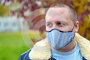 Casual young man wearing a cloth face mask