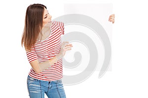 Casual young woman holding a white board