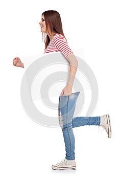 Casual young woman holding a white board