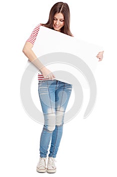 Casual young woman holding a white board