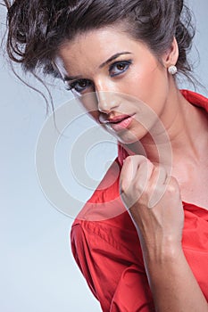 Casual young woman holds her collar