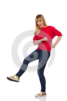 Casual Young Woman Is Kicking And Shouting