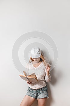 Casual young woman reading a book