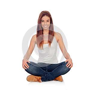 Casual young woman sitting on the floor