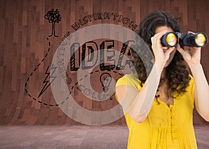 Casual young woman using binoculars