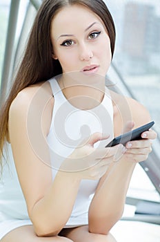 Casual young woman using tablet