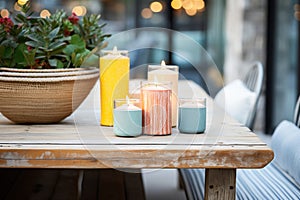 casually arranged patio candles on rustic table