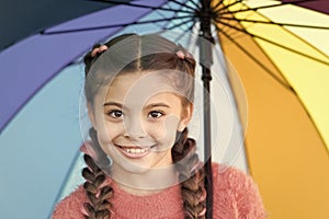 Casually beautiful. Happy childhood. Autumn snuggles. Happy little girl with colorful umbrella. Autumn fashion for cute photo