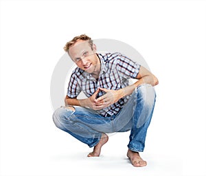 Casually clad man smiling white background