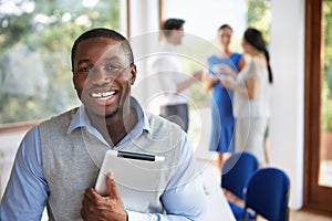 Casually Dressed Businessman Attending Meeting In Boardroom