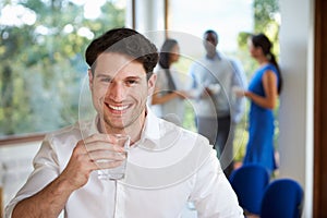 Casually Dressed Businessman At Meeting In Boardroom