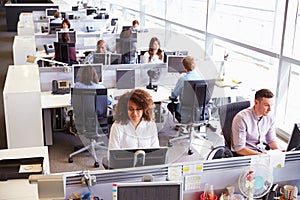 Casually dressed workers in a busy open plan office