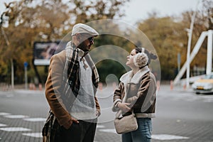 Casually dressed young couple enjoys a stroll in a city park