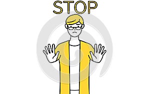 A casually dressed young man with his hand out in front of his body, signaling a stop