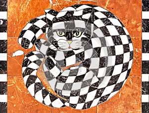 Cat from of black and white pieces of marble. Chess cat on an orange background