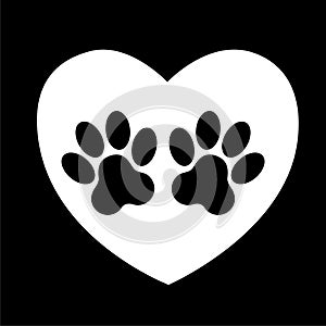 cat and dog paw print inside heart. The dog`s track in the heart.