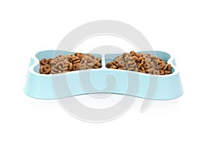 Cat food in blue bowl  on white background 