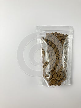 cat food inside a transparent plastic pack.