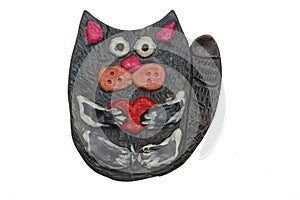 Cat with heart in his paws. Crafts from clay