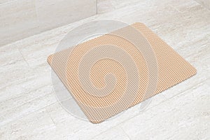 Cat litter trapping mat on bathroom floor