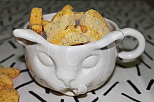 Cat-Shaped Cup Filled with Heart-shaped and Star Cookies