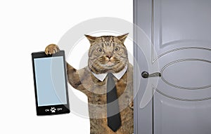 Cat with smartphone near door