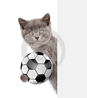 Cat with soccer ball peeking above white banner. Isolated on white background