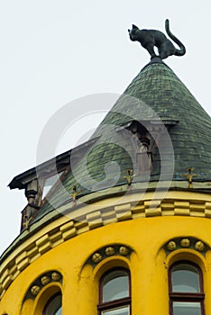 Cat statue on the roof. Detail of Cat House in the center of Riga, Latvia