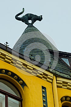 Cat statue on the roof. Detail of Cat House in the center of Riga, Latvia