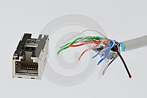 Cat6 SMTP wire with spread ends close to female LAN Cat6 connector in steel chassis