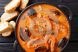 Catalan authentic spicy Suquet de Peix soup with potatoes, shrim