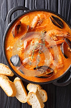 Catalan authentic spicy Suquet de Peix soup with potatoes, shrim